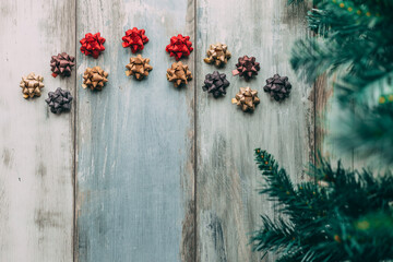 Christmas ornaments on wooden background with copy space left, flat lay
