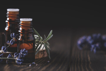  Aromatherapy and spa concept. Collection of different blank amber bottles with essential oils