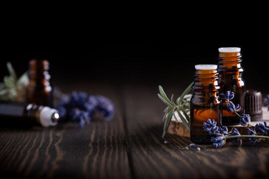  Aromatherapy and spa concept. Collection of different blank amber bottles with essential oils