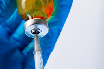 Doctor hands holding glass vial with medication