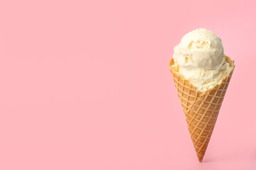 Delicious ice cream in waffle cone on pink background. Space for text