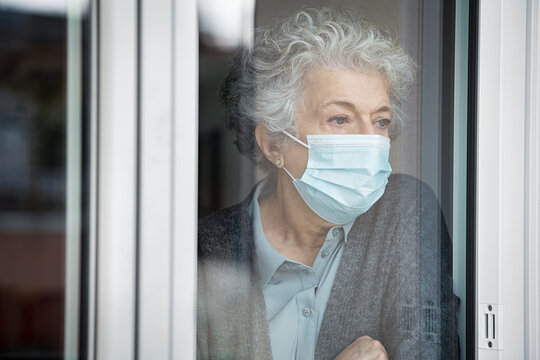 Depressed Senior Woman In Quarantine At Home Suffers From Loneliness