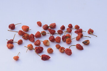 Dry chilli closeup photo on white background
