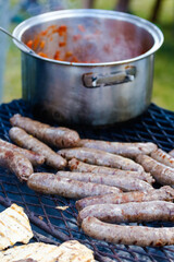 Close up image of traditional boerewors /' sausage on a braai/bbq in South Africa on an open fire