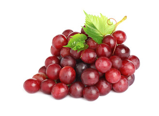 Bunch of fresh ripe juicy red grapes with leaves isolated on white