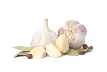 Fresh garlic bulbs and cloves with seasonings isolated on white. Organic food