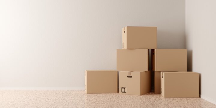 Brown moving storage cardboard boxes stacked in empty room in apartment or house with wooden floor with copy space