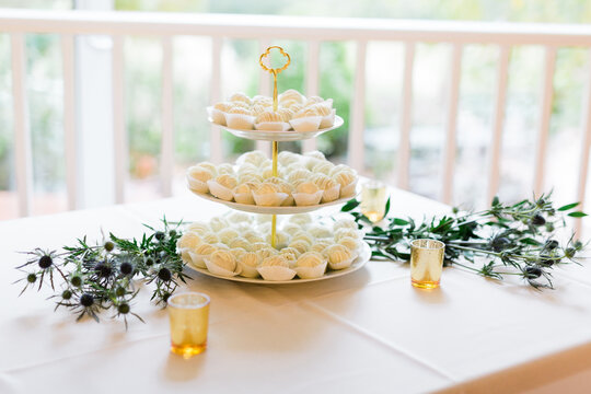 White Dessert Balls In A Tray With A Green Garland