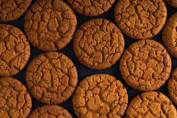 Delicious oatmeal gluten free cookies on dark background. Healthy food. Top view.