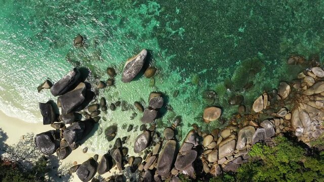 Footage B-roll of myanmar island beach ocean waves, Beautiful tropical beach and rocky coastline and beautiful forest. Nyaung Oo Phee Island Myanmar. Tropical seas and islands in southern Myanmar