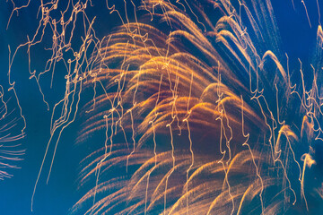 beautiful, bright, colorful fireworks at a city party at night