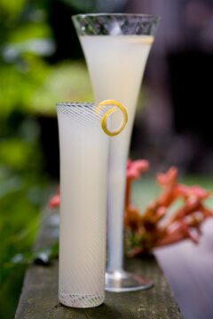 Faux 75 cocktail in glasses with lemon peel
