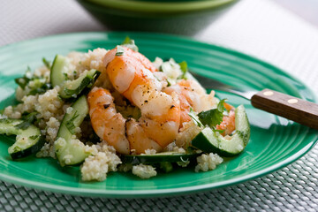 Close up of quinoa and shrimp salad with dressing