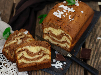 Fototapeta na wymiar Sweet coconut marble cake with chocolate and vanilla