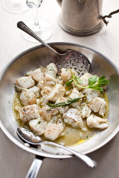 Close up of olive oil poached halibut nuggets
