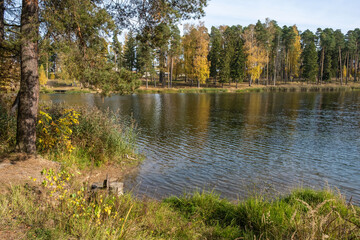 Fototapeta na wymiar Autumn landscape with a pond in the city of Kokhma, Ivanovo region.