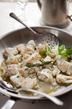 Close up of olive oil poached halibut nuggets