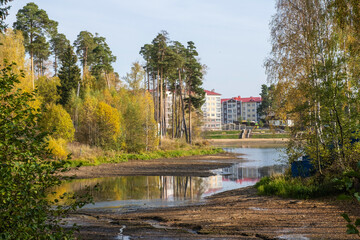Fototapeta na wymiar Autumn landscape with a dried-up pond in the city of Kokhma, Ivanovo region.