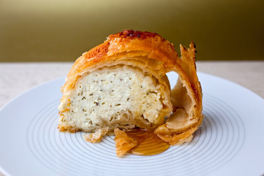 Slice of phyllo with feta torte, dill and nutmeg