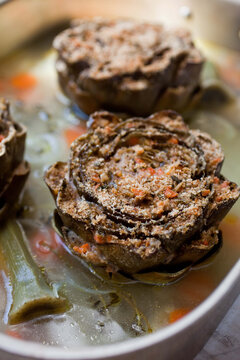 Stuffed artichokes with lemon zest, rosemary and garlic