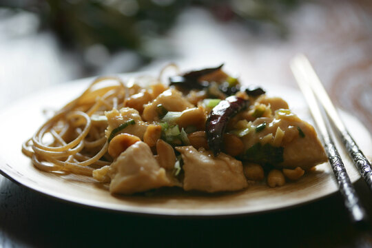Asian meal with meat and noodles on plate