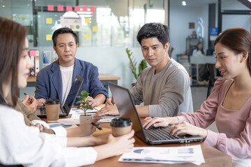 The Asian Employee Brainstorming business Meeting in the Office. Startup of the partnership, Discussion of planning the roles of staff in the corporate.