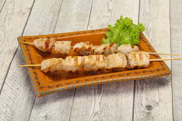Grilled pork skewer served salad
