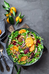 Tangerine and beet salad with arugula, walnuts and pine nuts