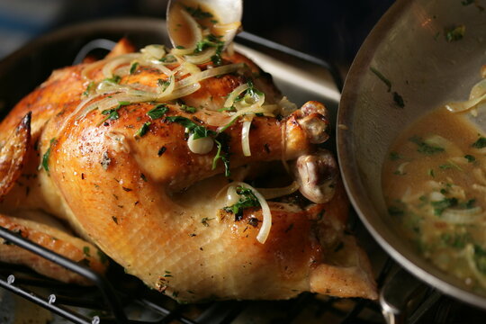 Whole roasted chicken with onion and herbs