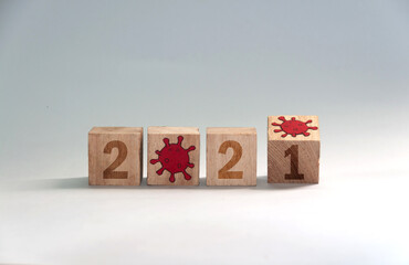 New year 2021, change from 2020 to 2021 concept, hand change wooden cubes. End of coronavirus pandemic
