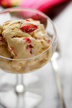 Close up of creamy dessert with strawberry