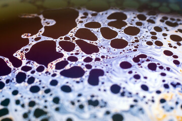 Beautiful psychedelic abstraction formed by light on the surface of a soap bubble