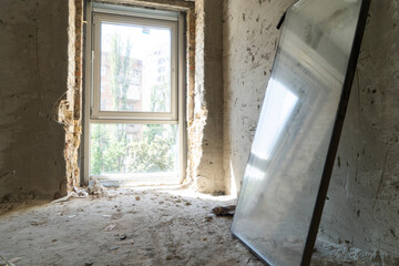 Empty unfinished interiors. Replacement of windows during the construction of the hotel
