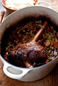 Close up of lamb roast with olives and celery pure