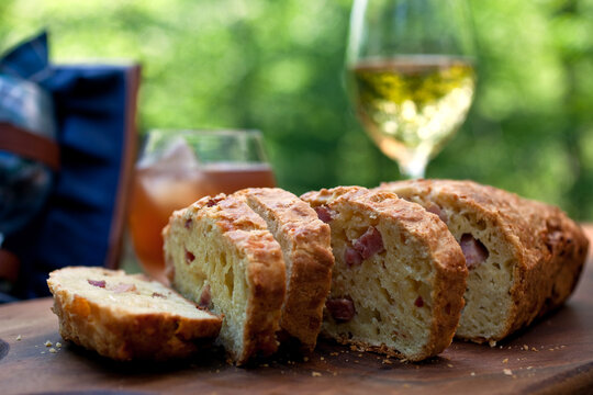 Close up of savory ham and gruyere bread on cutting board