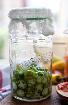 Close up of jars with chili and spicy sauce