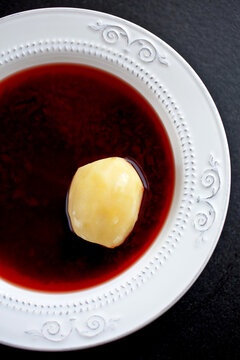 Close up of plate with traditional Jewish cold borsch