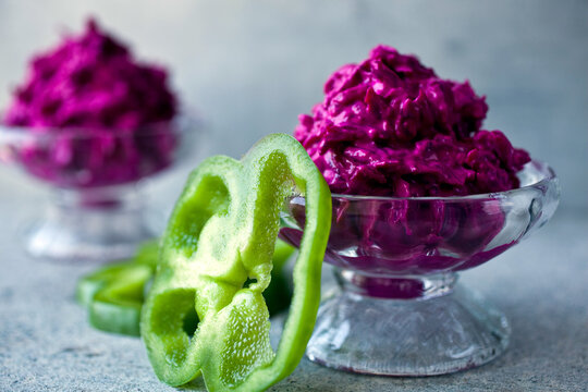 Close up of purple beet tzatziki sauce
