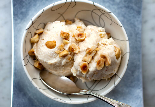 Close up of hazelnut and vanilla ice cream in bowl