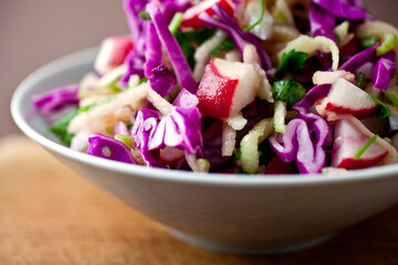 Apple coleslaw with red cabbage and radishes