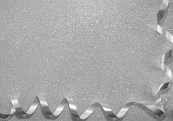 Beautiful glitter silver ribbon. isolated on white, gray  background. empty copy  space for inscription.