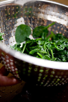 Close up of spinach on strainer
