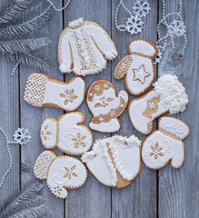 Christmas cookies decorated with royal icing on wooden table