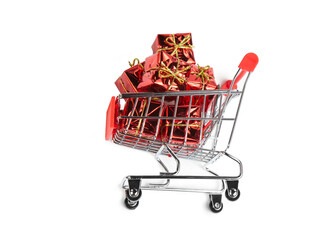 Gifts in the buyer's basket. Full shopping cart. White isolated background. The concept of gifts and purchases before the New Year.