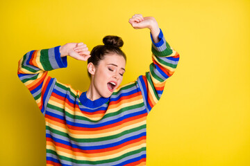 Photo of sleepy cute woman yawn raise hands closed eyes stand copyspace isolated on yellow color background