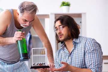 Young son student and dad alcoholic