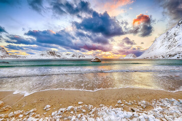 Splendid winter scenery with Haukland beach during sunset and snowy  mountain peaks near Leknes.