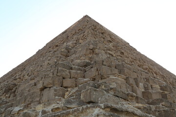 Low angle view of one of the great historical pyramids of Giza, one of the Seven Wonders of the World, Giza - Egypt