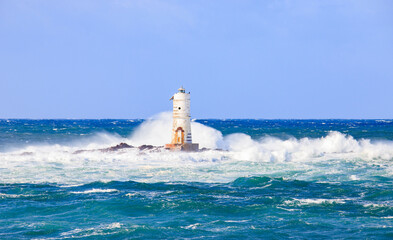 lighthouse of the mangiabarche of calasetta in a stormy day, sardinia

