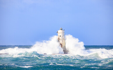 lighthouse of the mangiabarche of calasetta in a stormy day, sardinia
